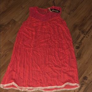 Women’s dress in coral with lace detail